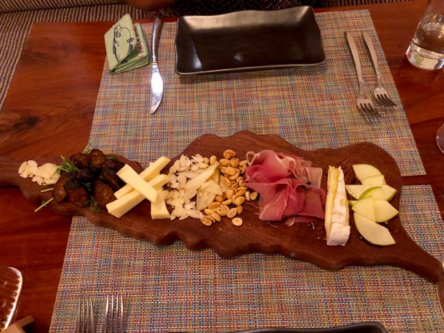 balterSTX Charcuterie Board served on mahogany wood in shape of St. Croix